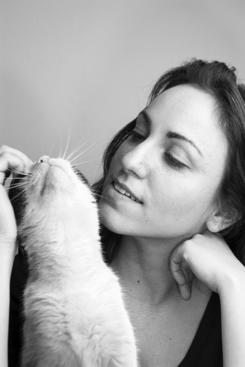 Woman playing with cat